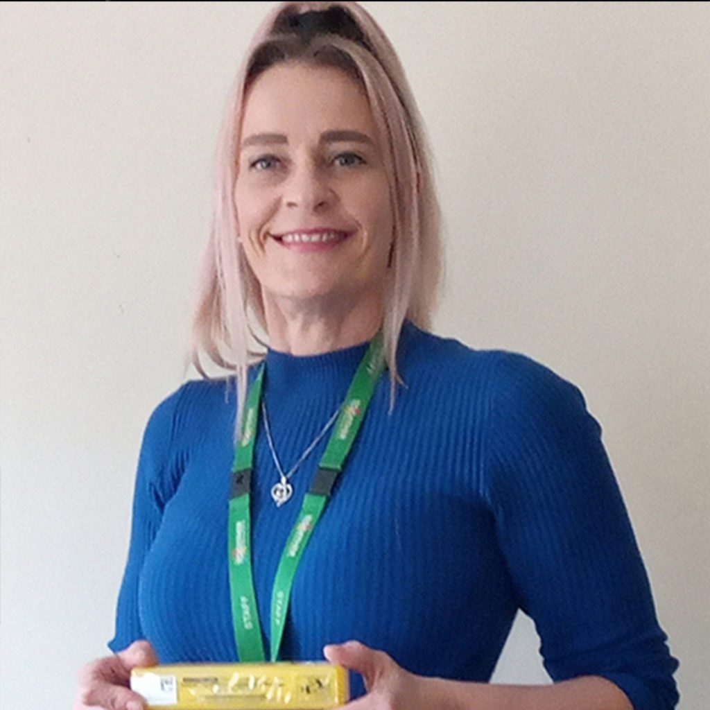 EDP worker claire holding a box containing naloxone