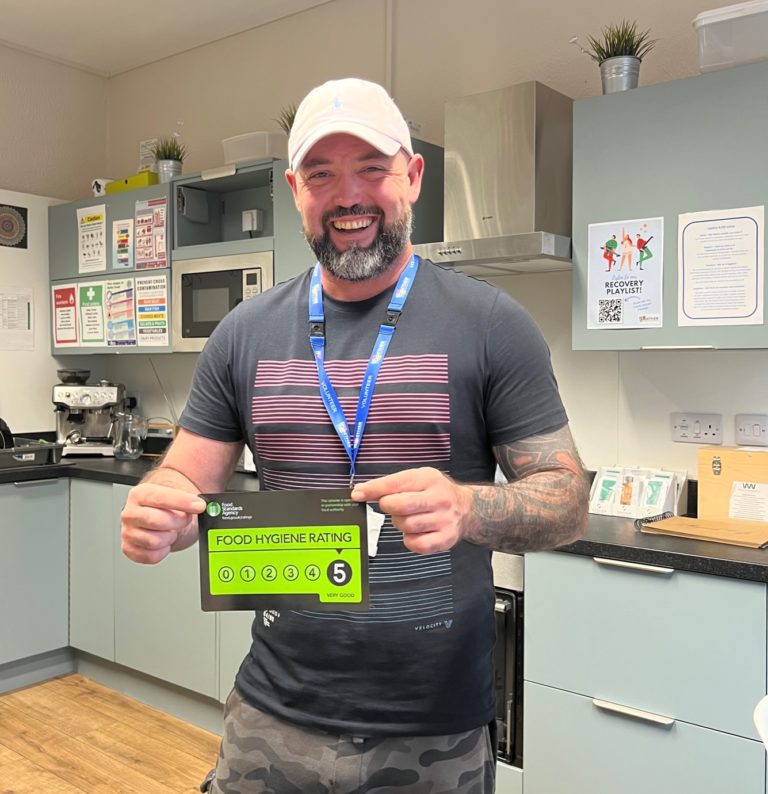 service user holding a 5* food hygiene certificate from the Exeter hub kitchen