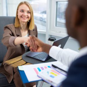 Female Recovery Worker shaking the hands of a person she is suppoting